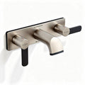 Brushed nickel bathroom faucet with dual handle and wall-mounted design